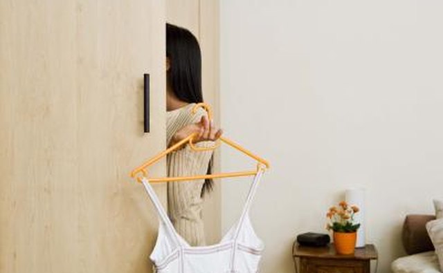 woman cleaning out her closet