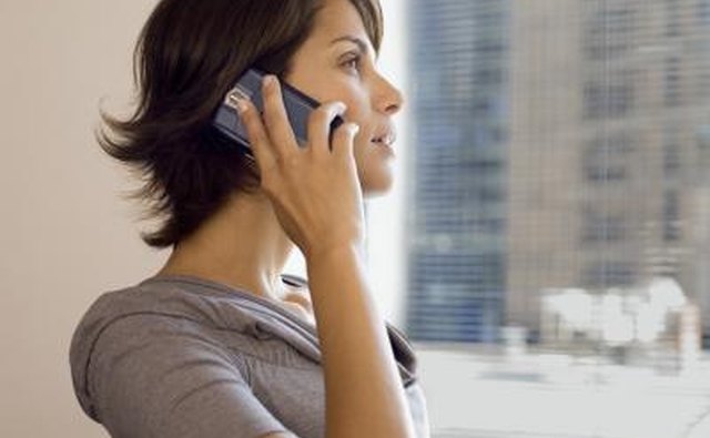 Woman using cell phone.