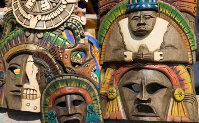 Mexican masks are displayed outdoors.