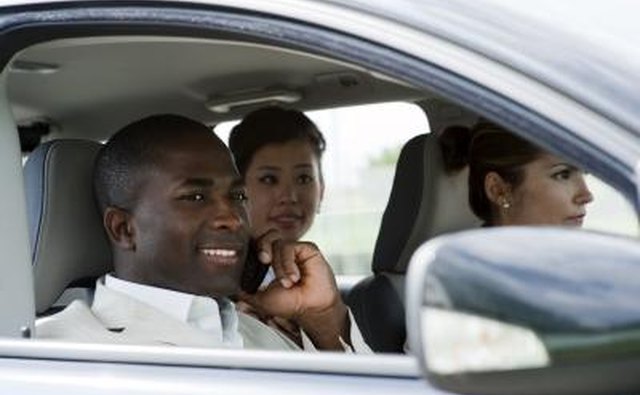 Woman testing car with friends