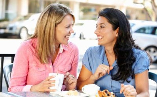 Friends laughing over breakfast