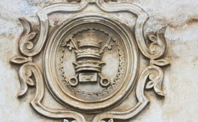 An emblem on a relief sculpture signified by two keys crossing.