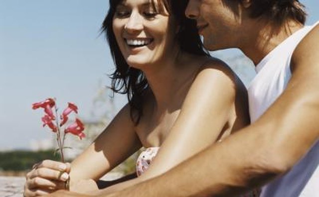 Young man giving flowers