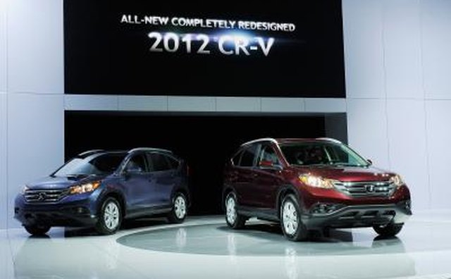 Two Honda CR-Vs on display at a car show.