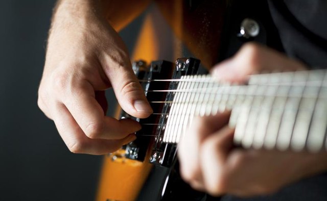 Man playing country-western music.