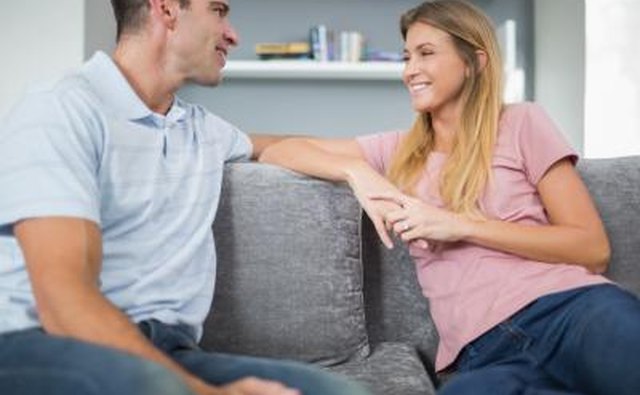 couple talking calmly on couch