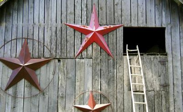 Three large barn stars on a barn near the hay loft.