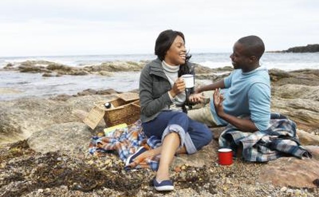 Couple have picnic on the beach