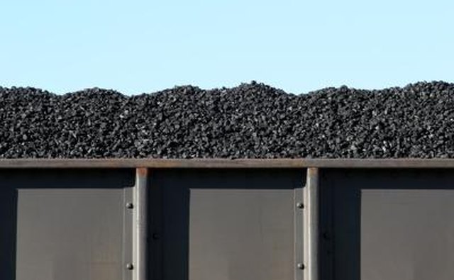 A boxcar filled with coal.