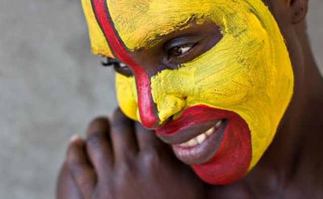 Young Zulu female with painted face.