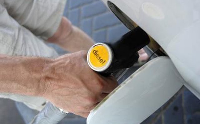 Man filling vehicle with diesel