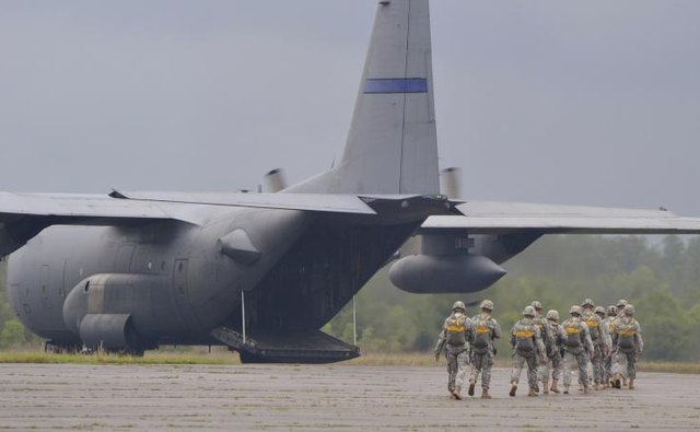 Troops deploying on a C130.
