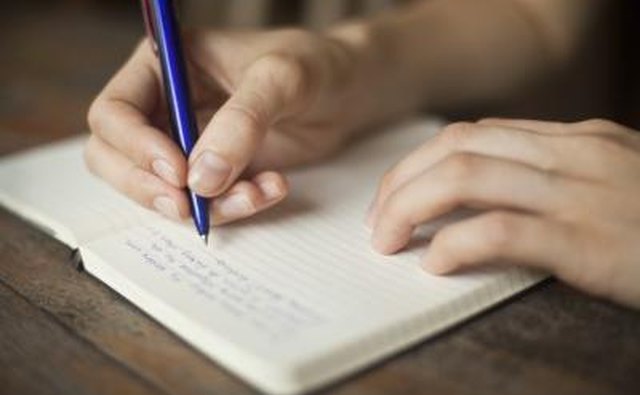 Person writing a letter.