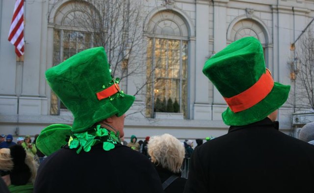 People wearing leprechaun hats.