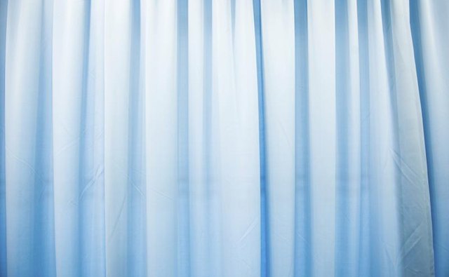 Blue curtains covering a window.