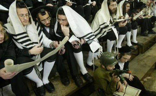 Ultra-Orthodox Jews read from the Book of Esther during Purim in Israel