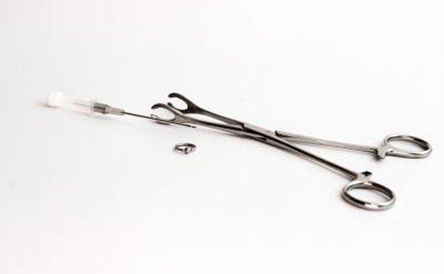 Piercing needle and supplies.