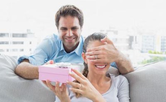 A couple exchanging anniversary gifts.