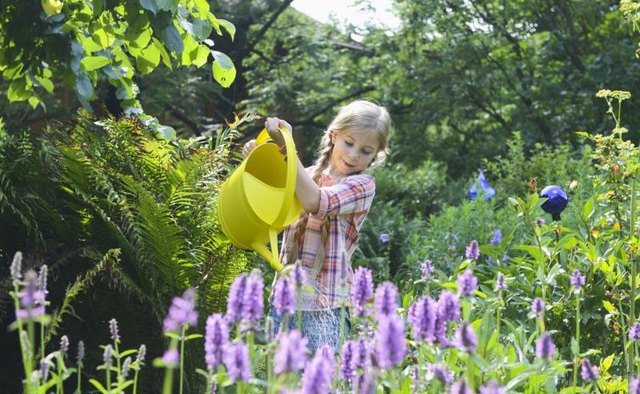 Girl watering flowers