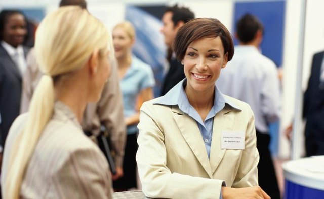 Friendly rep speaks with visitor