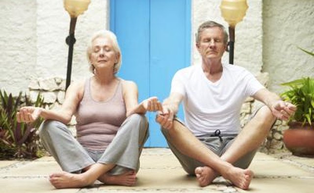 Senior couple meditating