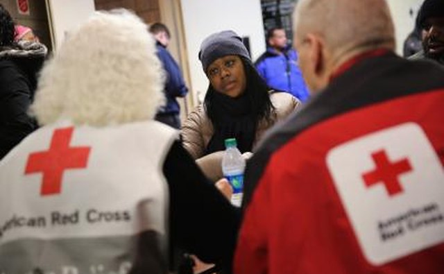 American Red Cross volunteers talking to woman