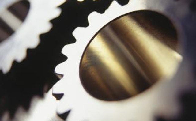 Gears are parts of metal that mesh and grind together.