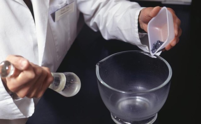 A druggist uses a mortar and pestle.