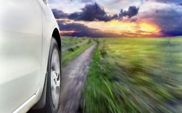 Car driving on dirt road