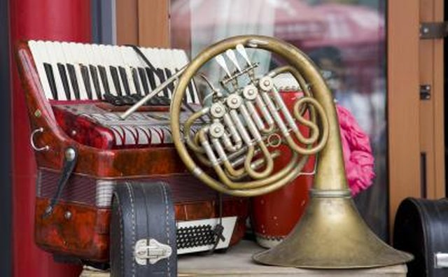 A close-up of used instruments on a small table outside of a shop.