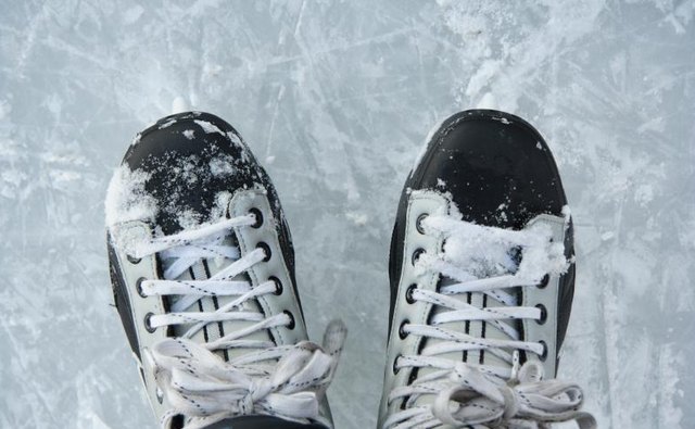 Hockey skates on ice.