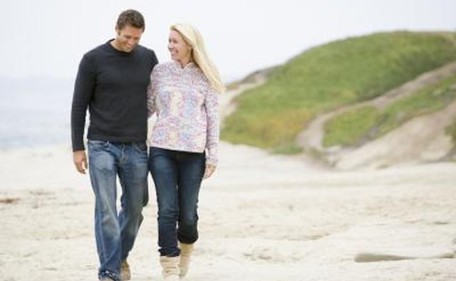 couple taking a romantic walk on the beach