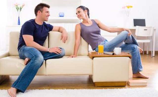 woman talking to man on couch