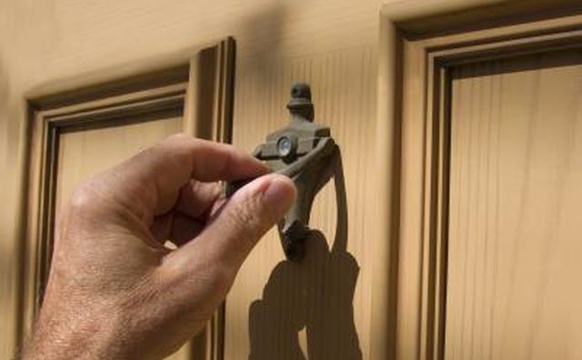 Hand on door knocker.