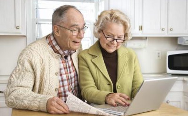 Senior couple working on a laptop.