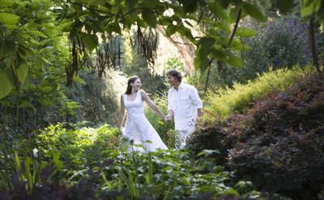 Couple walking through garden