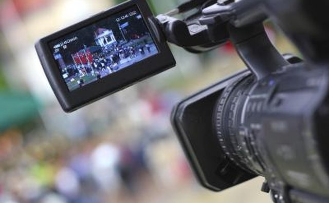 Video camera filming street scene