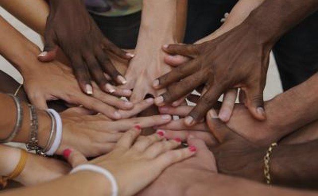 Hands piling together in agreement.