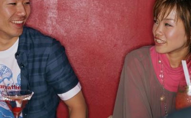 Young couple talking inside a nightclub