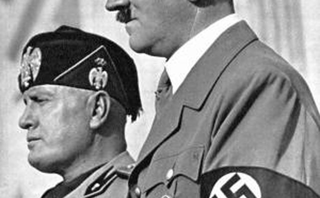 Adolf Hitler can be seen wearing his own Iron Cross, awarded during World War I.