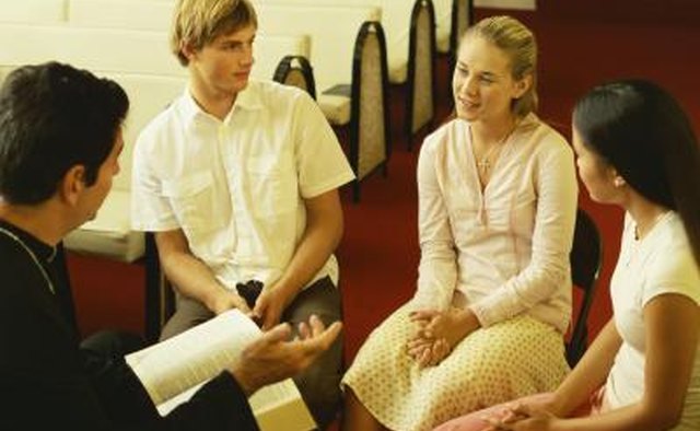 Priest counseling the youth.
