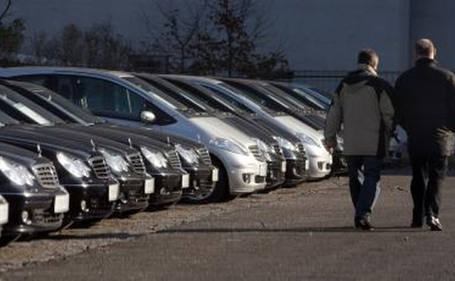 Two men walking at Mercedes dealership