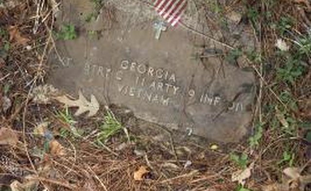 Some older cemeteries create concrete lips over flat markers for flags.