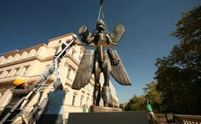 A sculpture of the Mesopotamian god, Pazuzu, on display outside of an art museum in London.