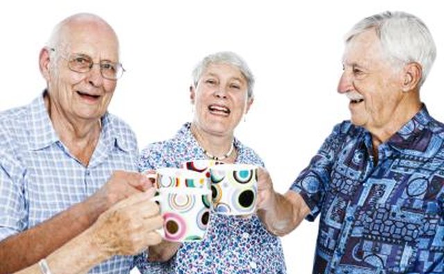 Seniors with mugs in hand.