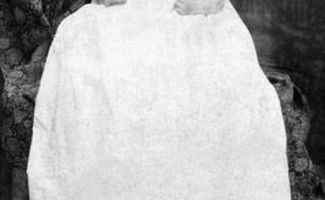 Both boys and girls often wear long white christening gowns when being baptized.