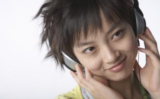 A Chinese teenager listens to music