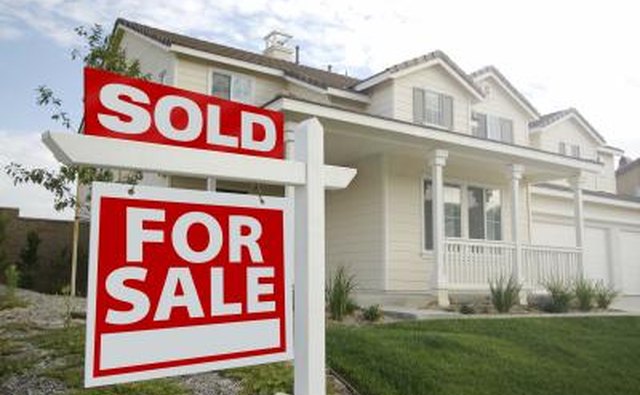 Sold sign in front of house