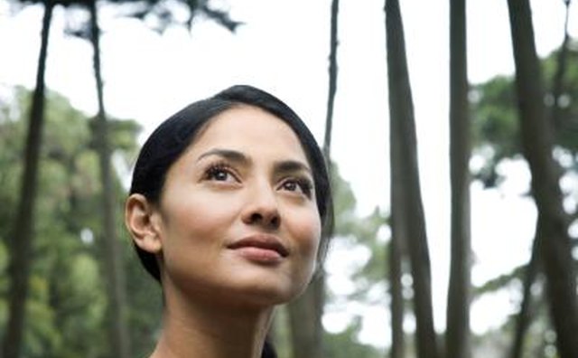 Woman looking up and thinking.