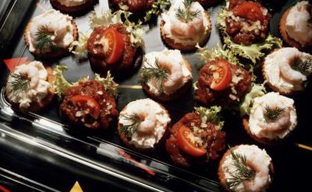 Close up of tatar and shrimp snacks as appetizers